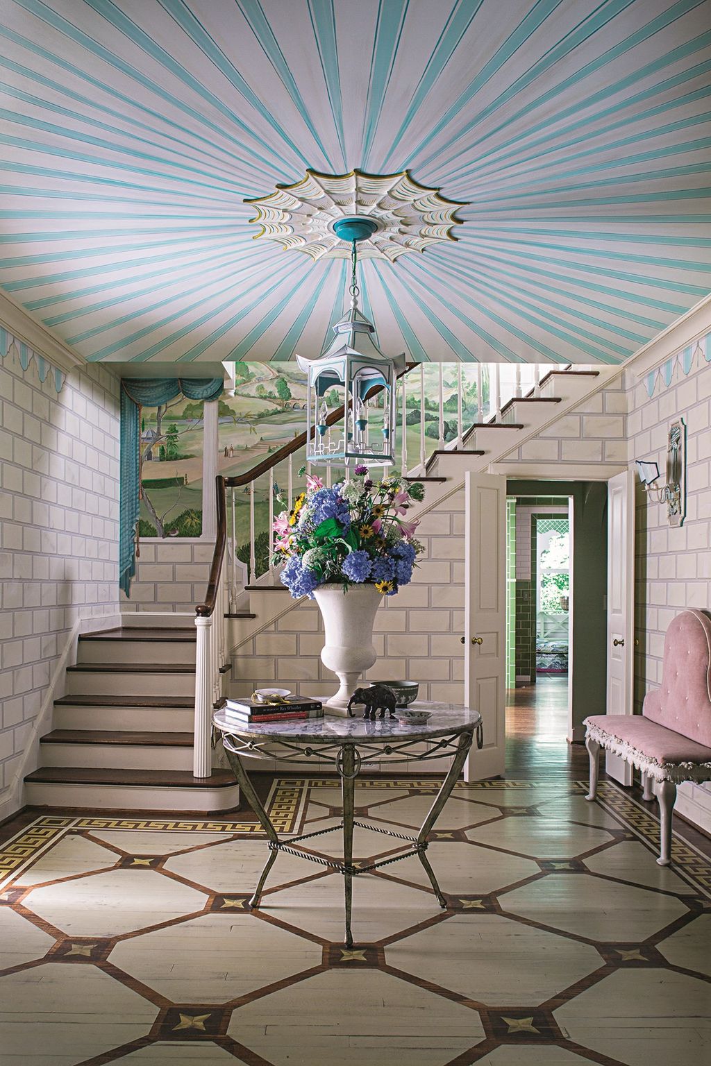 Image may contain Interior Design Indoors Flooring Floor Furniture Living Room Room Banister Handrail and Table