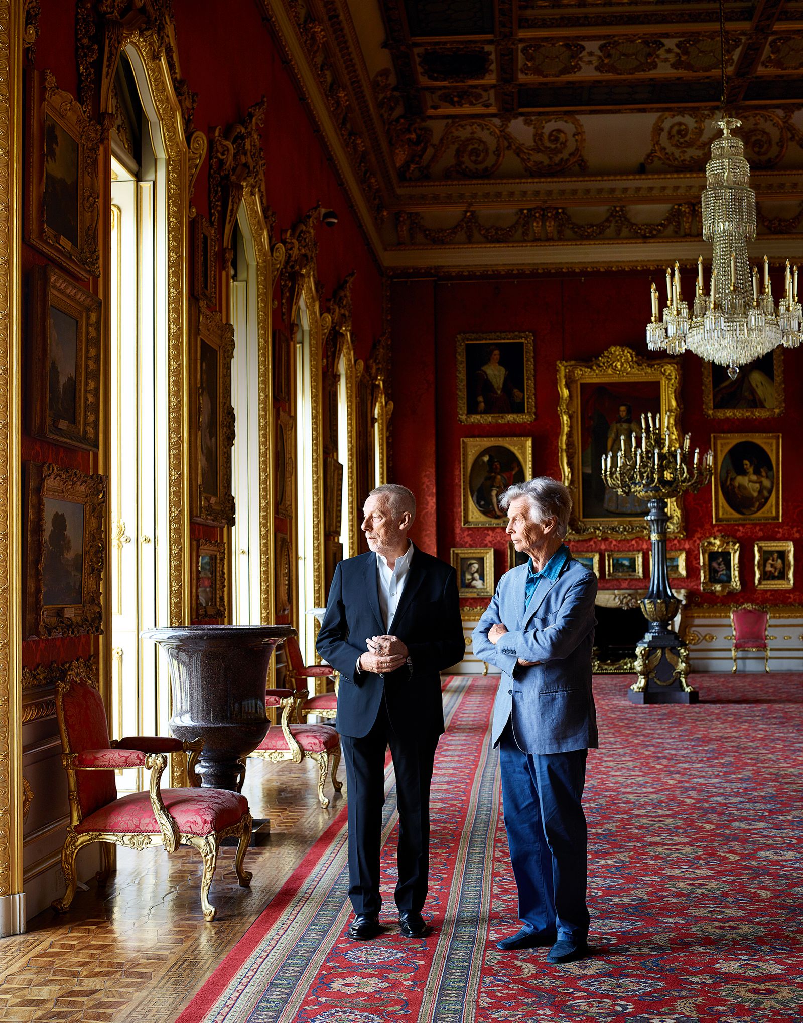 Image may contain Furniture Human Person Flooring Floor Clothing Suit Coat Overcoat Apparel House and Housing