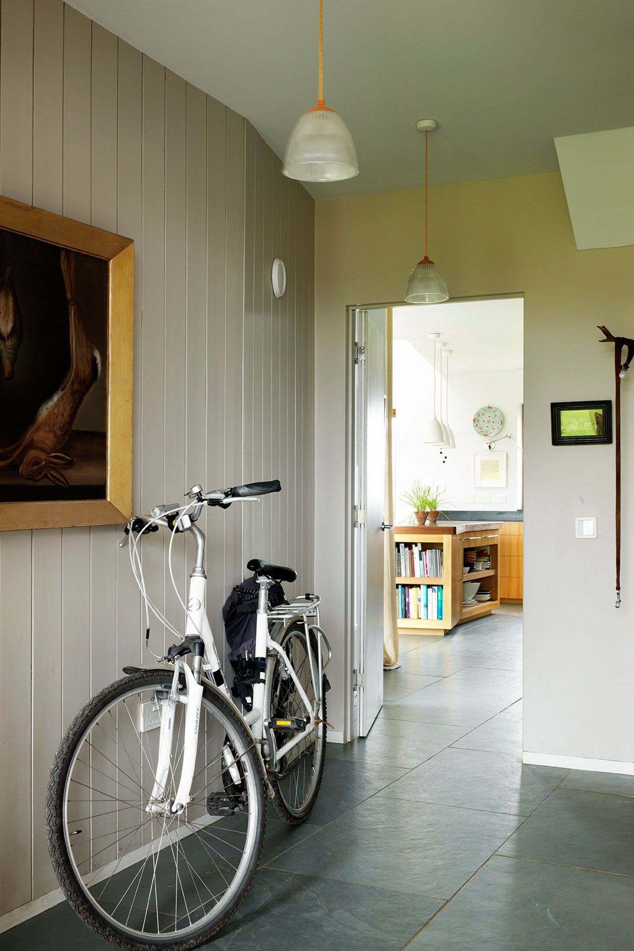 Image may contain Wheel Machine Vehicle Transportation Bicycle Bike Interior Design Indoors Flooring and Human