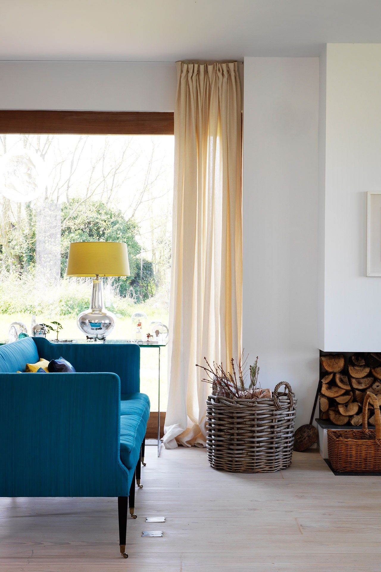 Image may contain Home Decor Furniture Lamp Table Lamp Living Room Indoors Room Interior Design Cushion and Pillow