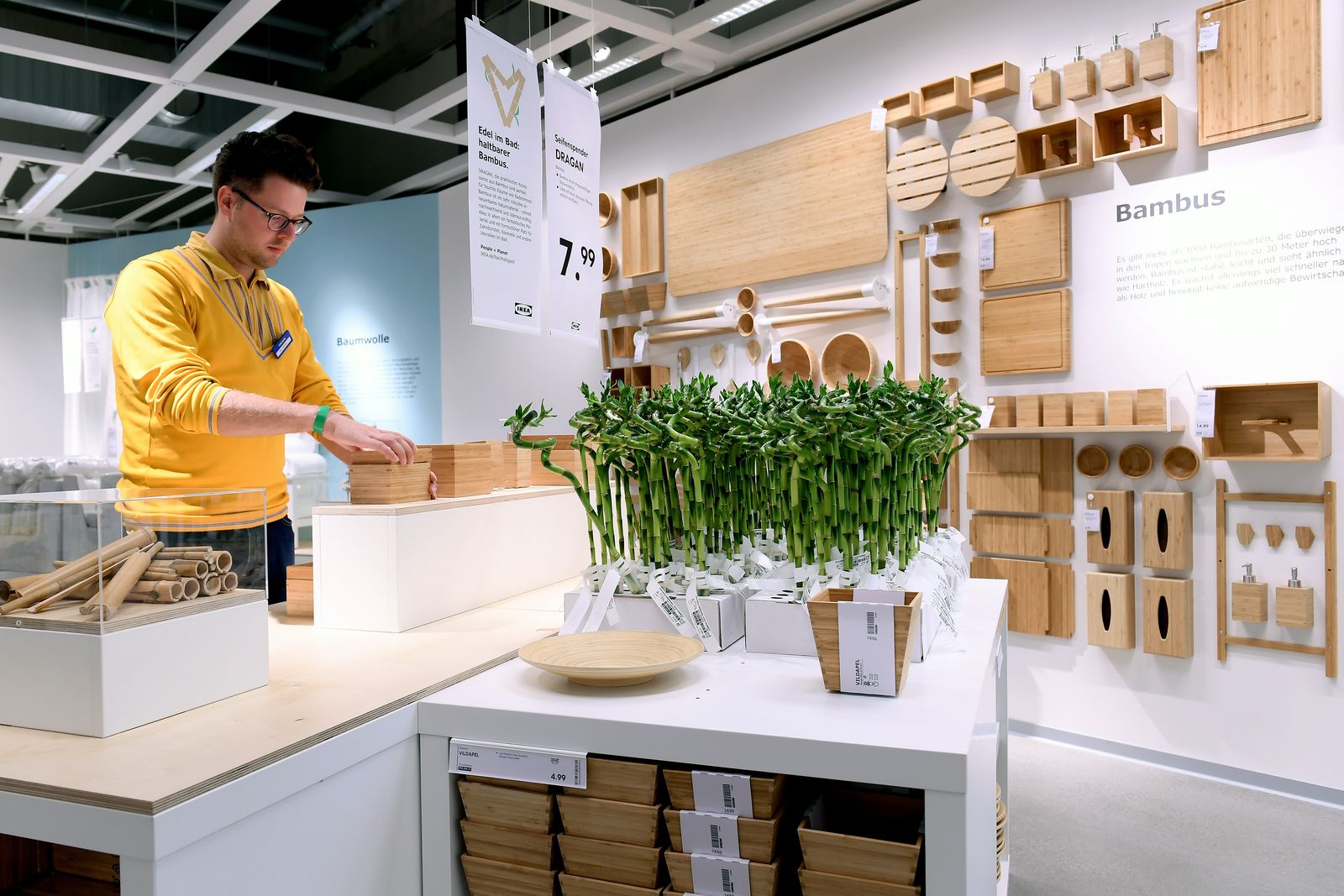 Image may contain Human Person Restaurant Plant Shelf and Indoors