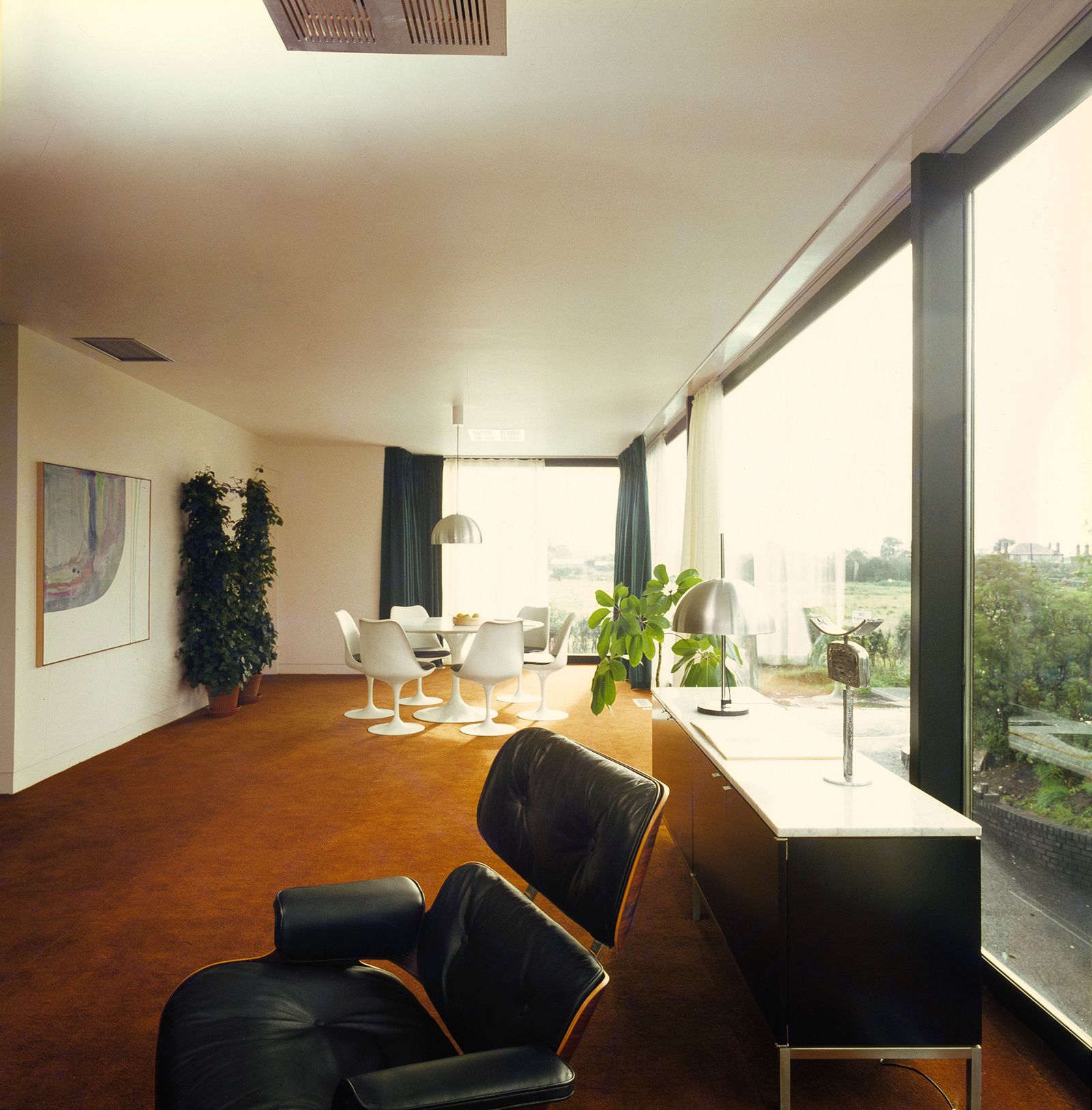 Image may contain Furniture Flooring Room Indoors Living Room Interior Design Wood Hardwood Floor and Waiting Room