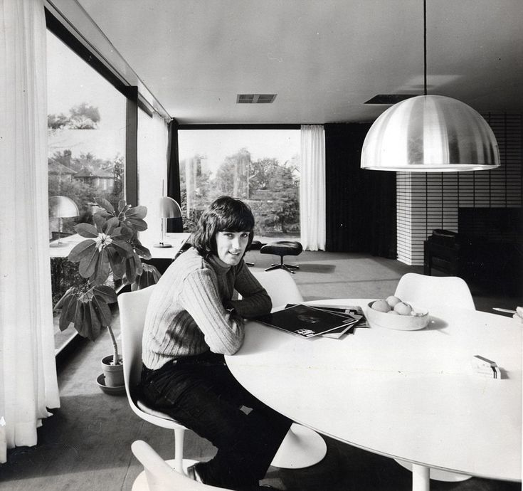 Image may contain George Best Human Person Furniture Interior Design Indoors Table Chair Room and Electronics