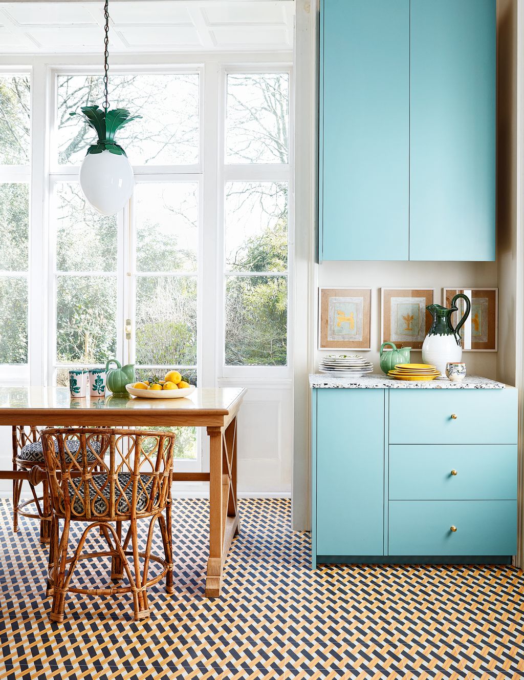 Gabby Deeming creates pretty schemes in shades of gold and mint combining bespoke wallcoverings with rattan and bamboo...