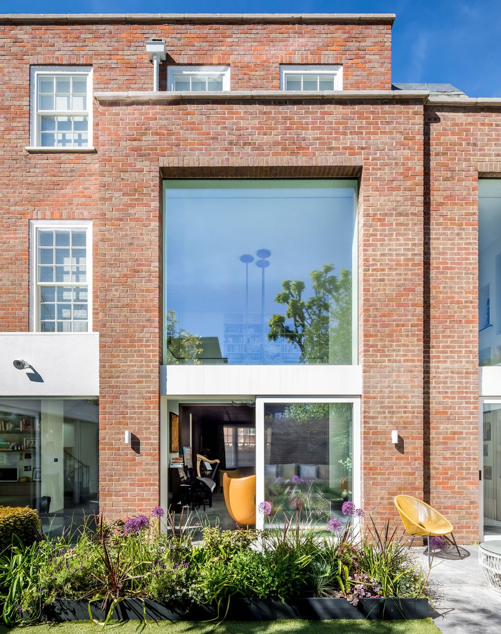 Image may contain Brick Door and Plant