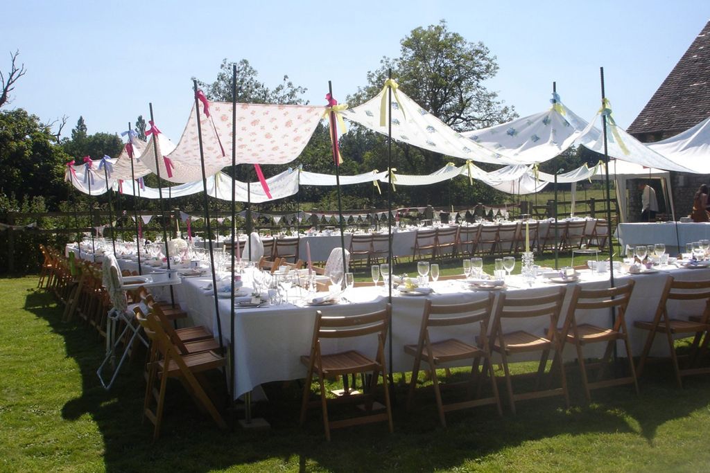 Image may contain Furniture Chair Human Person Grass Plant Table and Dining Table