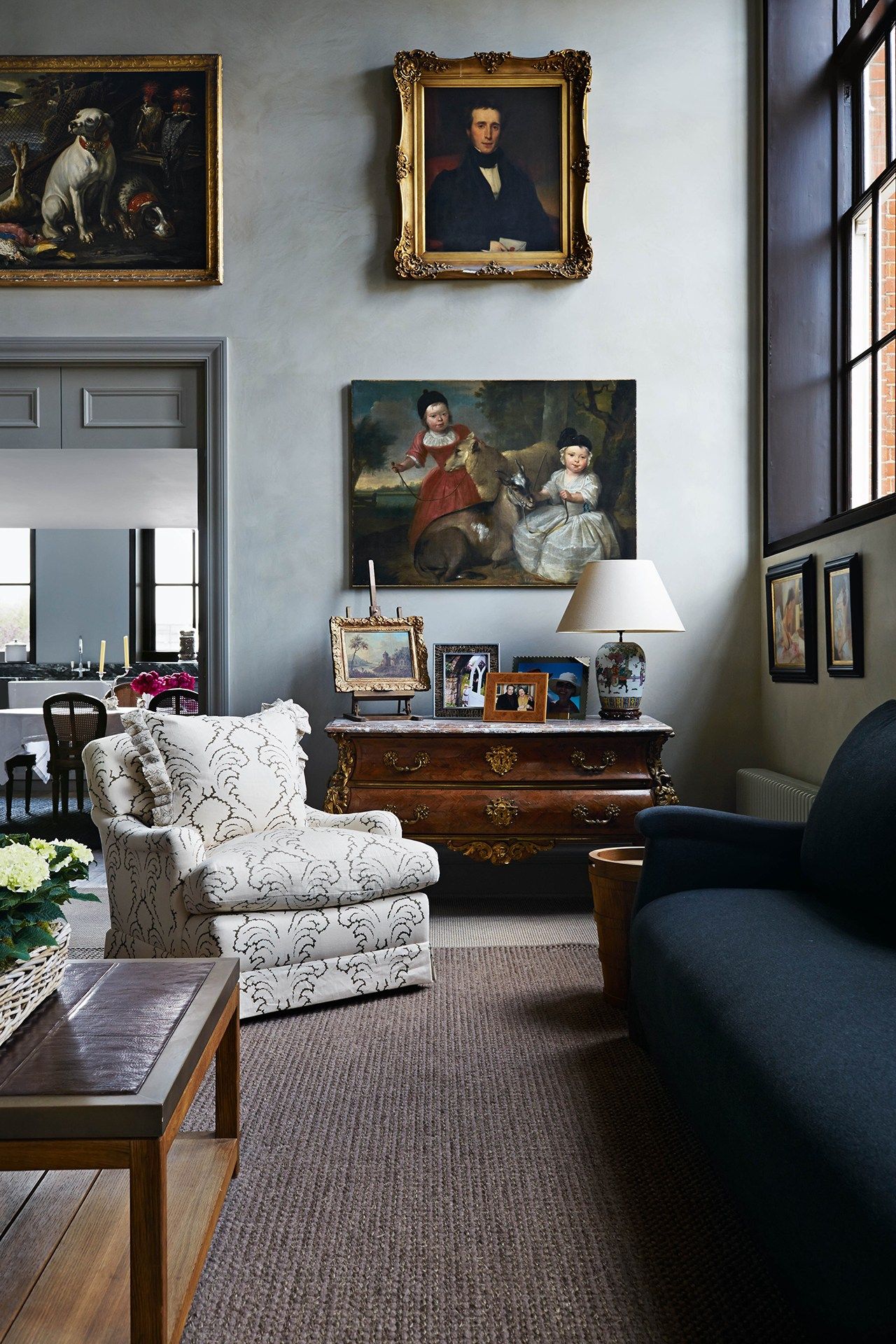 Image may contain Living Room Room Indoors Furniture Couch Human Person Interior Design and Rug