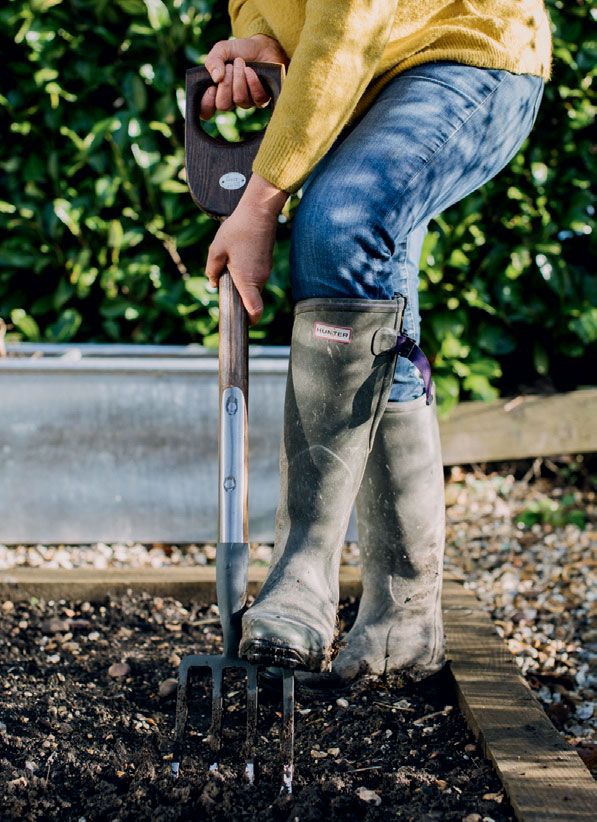 Digging over beds in the vegetable garden.