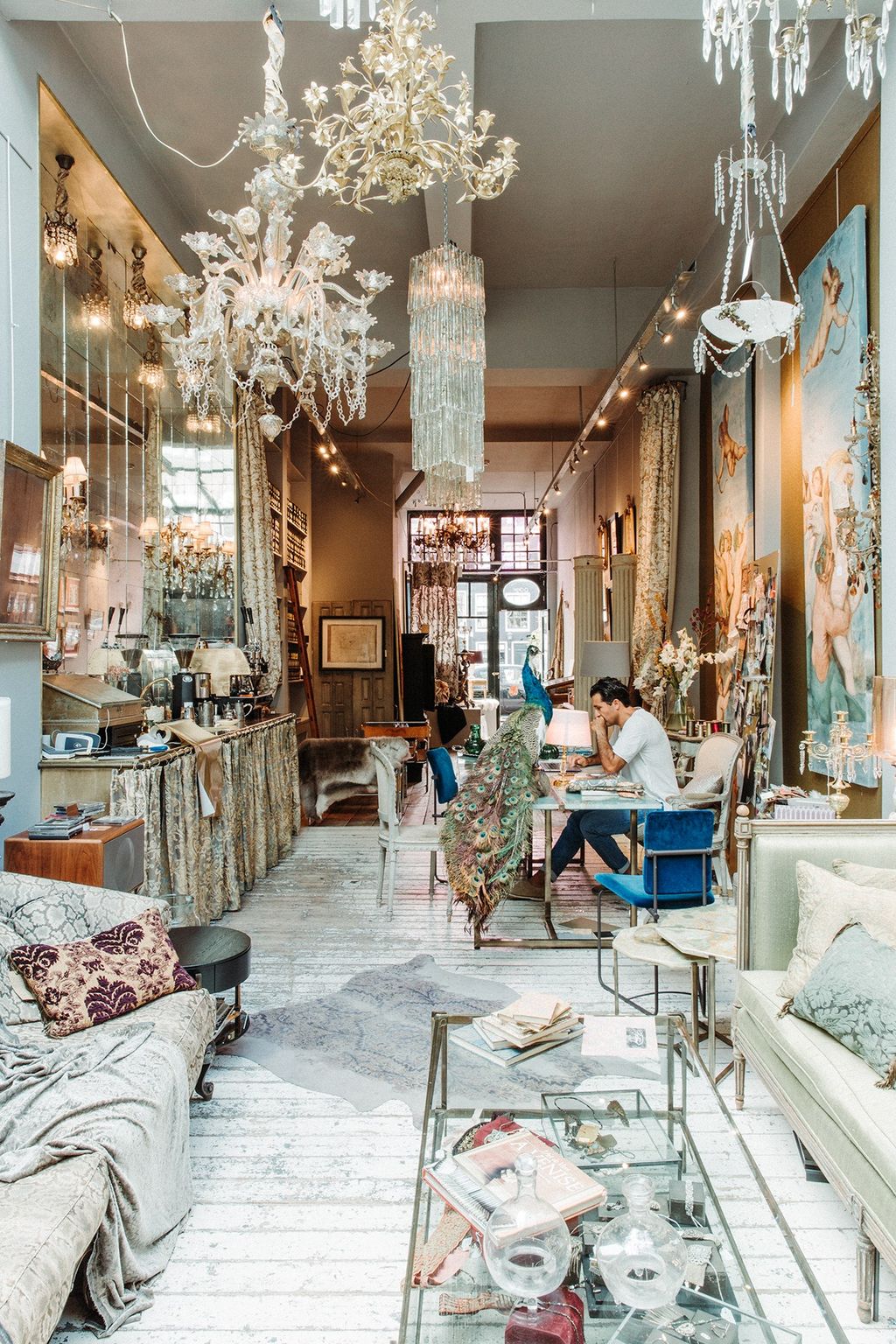 Image may contain Human Person Interior Design Indoors Restaurant Flooring Living Room Room Floor and Cafe