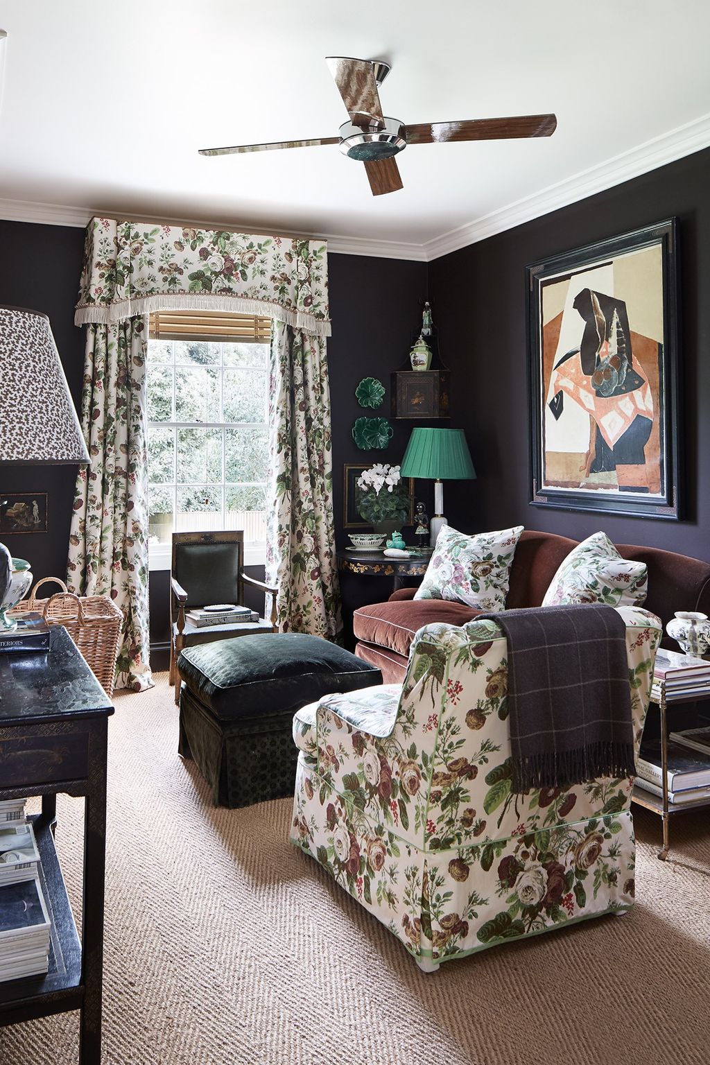 Image may contain Furniture Living Room Room Indoors Appliance Ceiling Fan Couch Home Decor Rug and Table