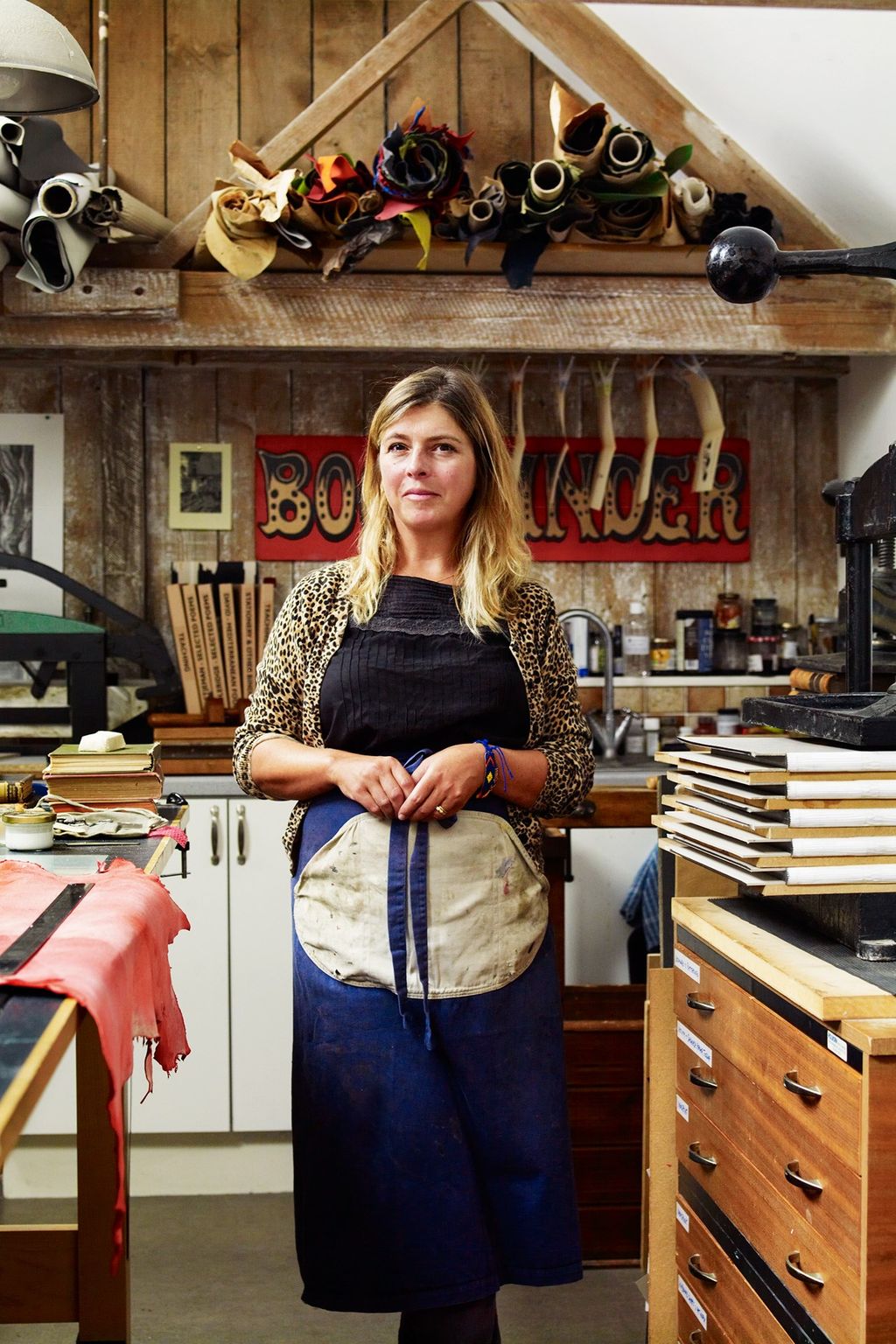 Image may contain Human Person Clothing Apparel Shelf Helmet Wood Furniture Plywood Indoors and Sleeve