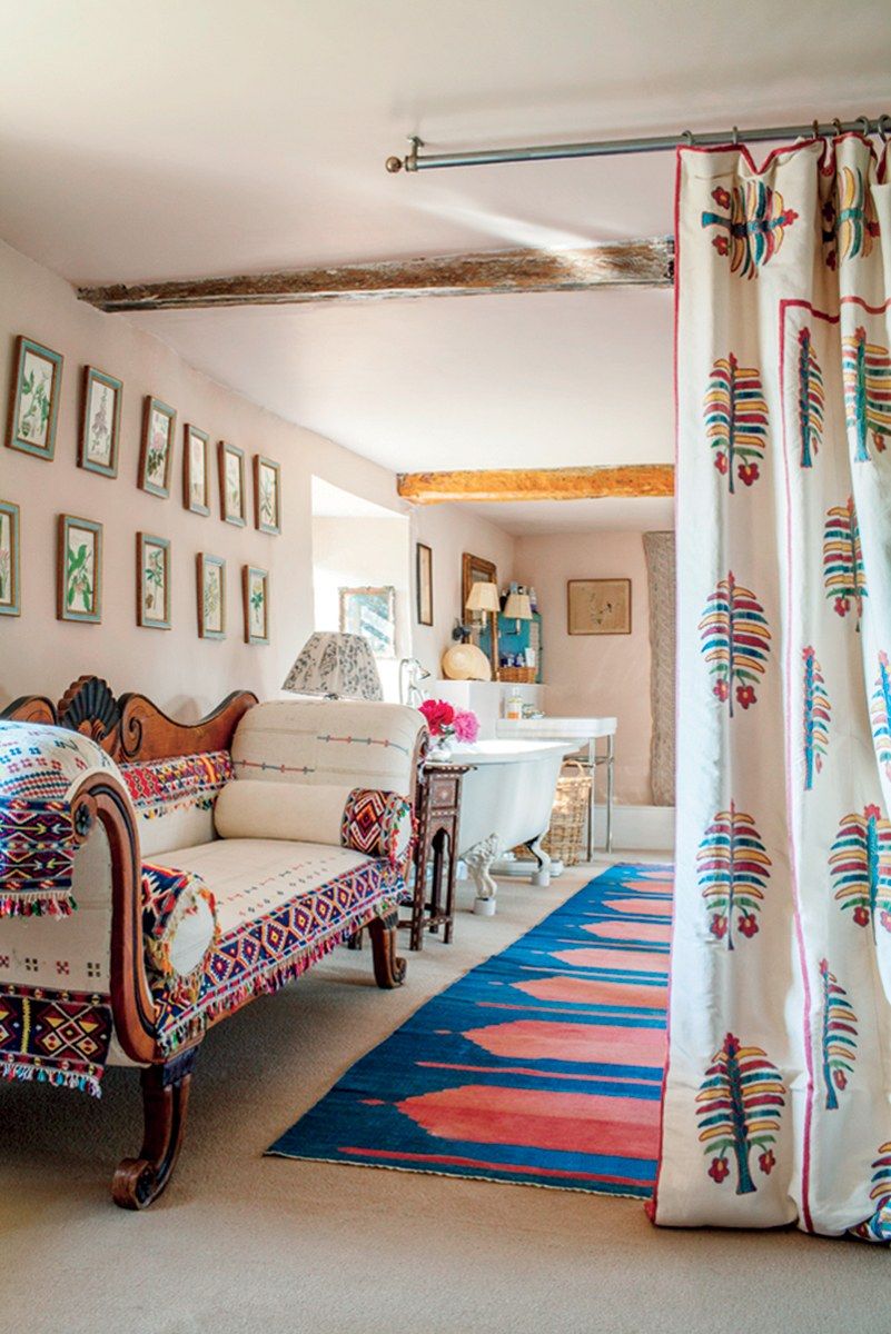 Image may contain Living Room Indoors Room Home Decor Furniture Interior Design Couch and Rug