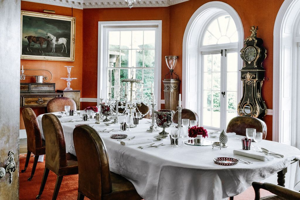 Image may contain Furniture Chair Home Decor Indoors Room Dining Room Table Tablecloth and Dining Table