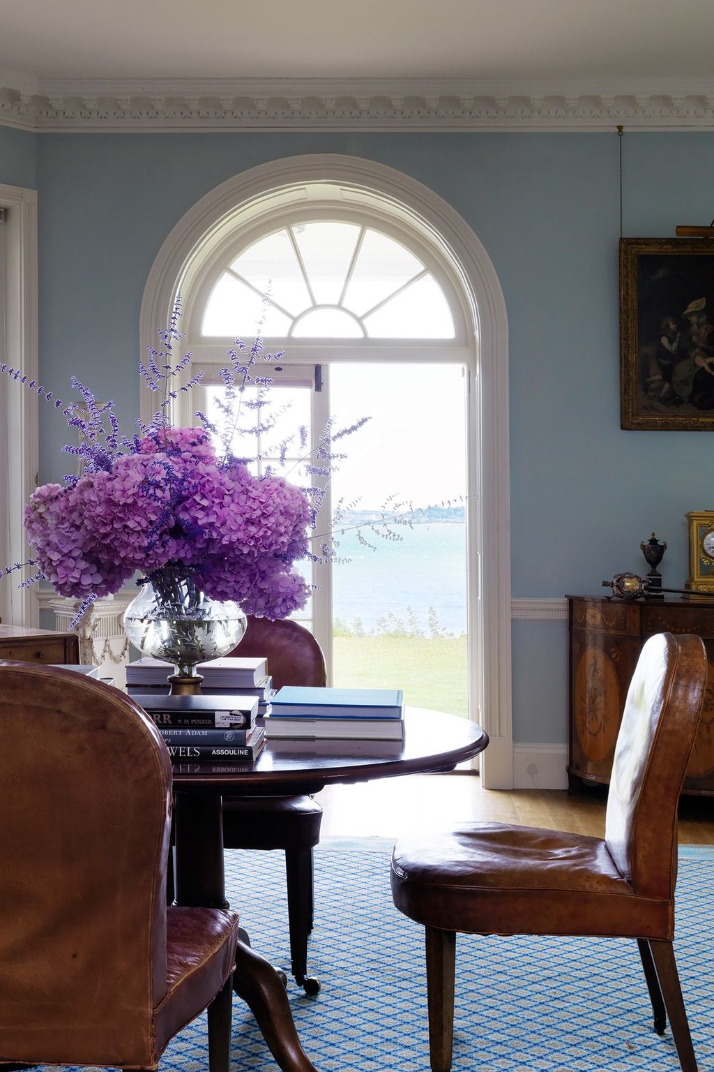 Image may contain Furniture Chair Interior Design Indoors Living Room Room Plant Flower Blossom and Home Decor