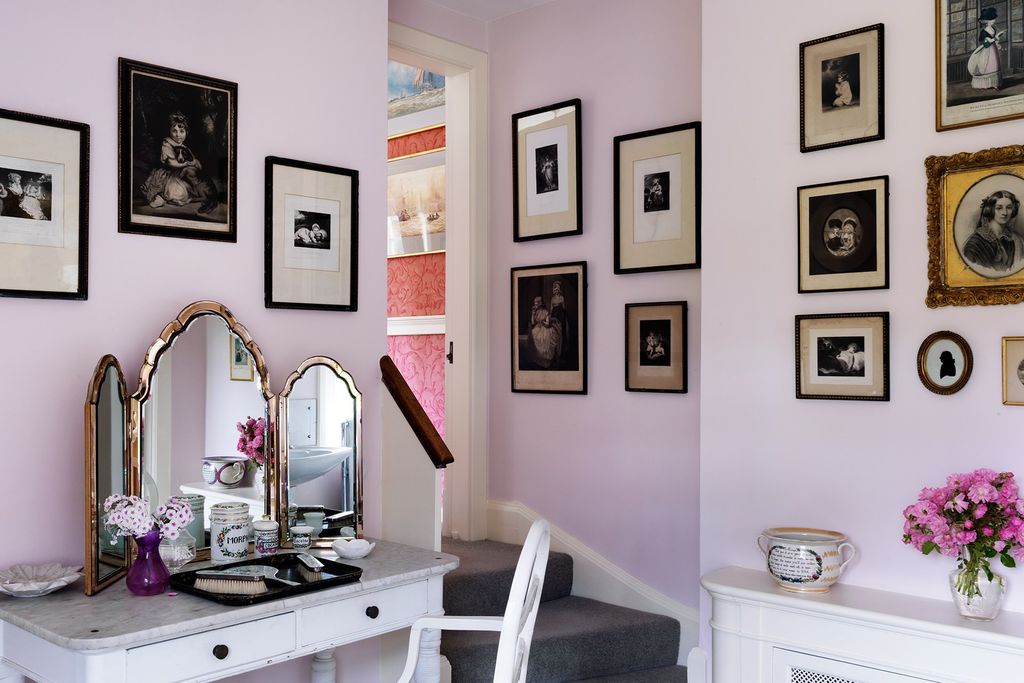 Steps near the dressing table lead into the connected bedroom.