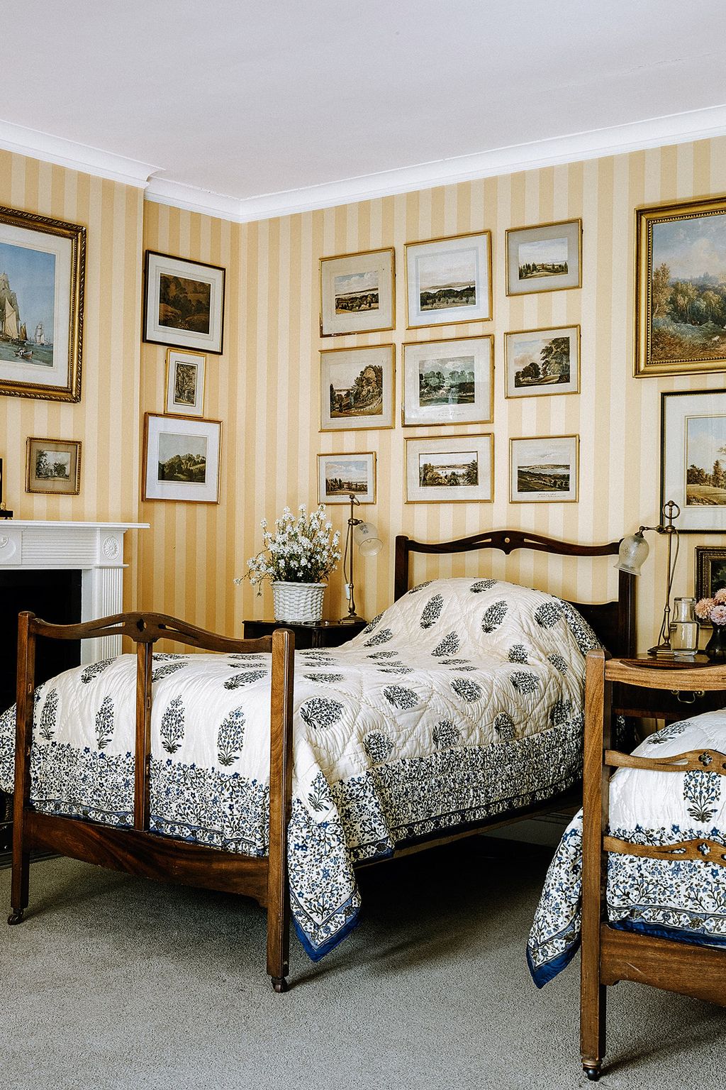 A striped yellow wallpaper sets the bright scheme in the Cadland Room.
