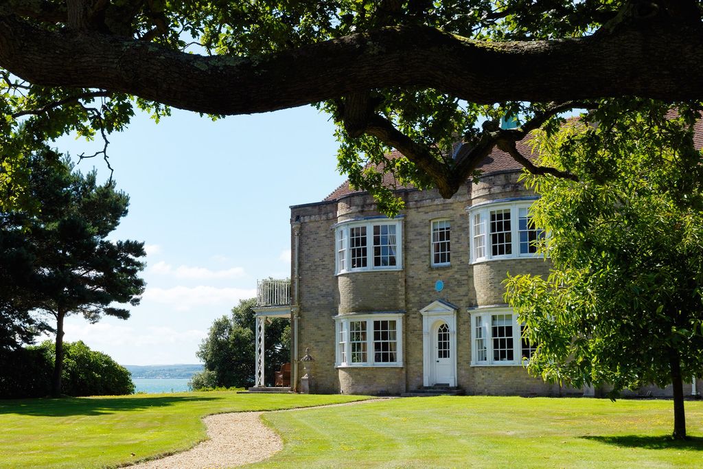 Image may contain Plant Grass Lawn Tree and Tree Trunk