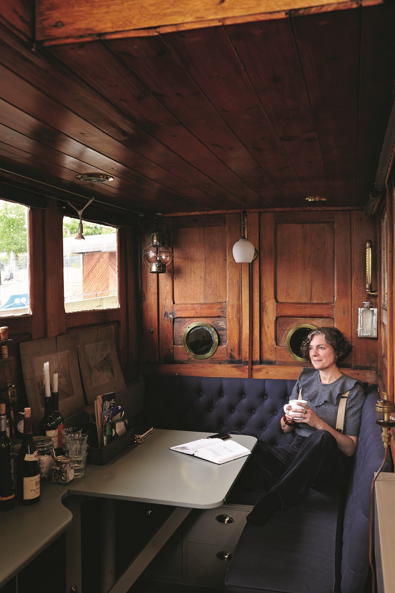 Image may contain Human Person Furniture Desk Table Wood Indoors and Room
