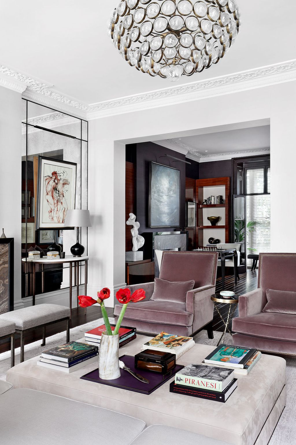 Image may contain Living Room Indoors Room Furniture Couch Table Interior Design Coffee Table Lobby and Rug