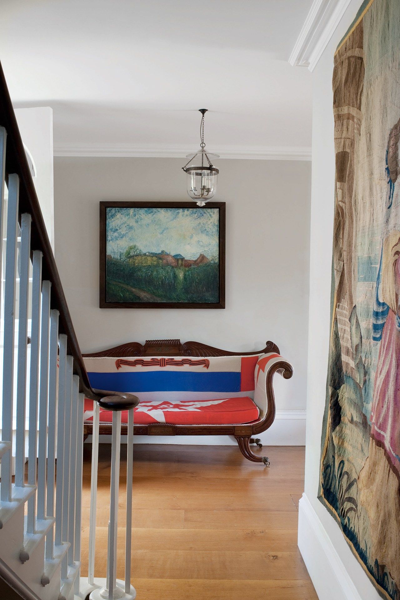 Image may contain Living Room Room Indoors Flooring Wood Furniture Couch Hardwood Home Decor and Interior Design