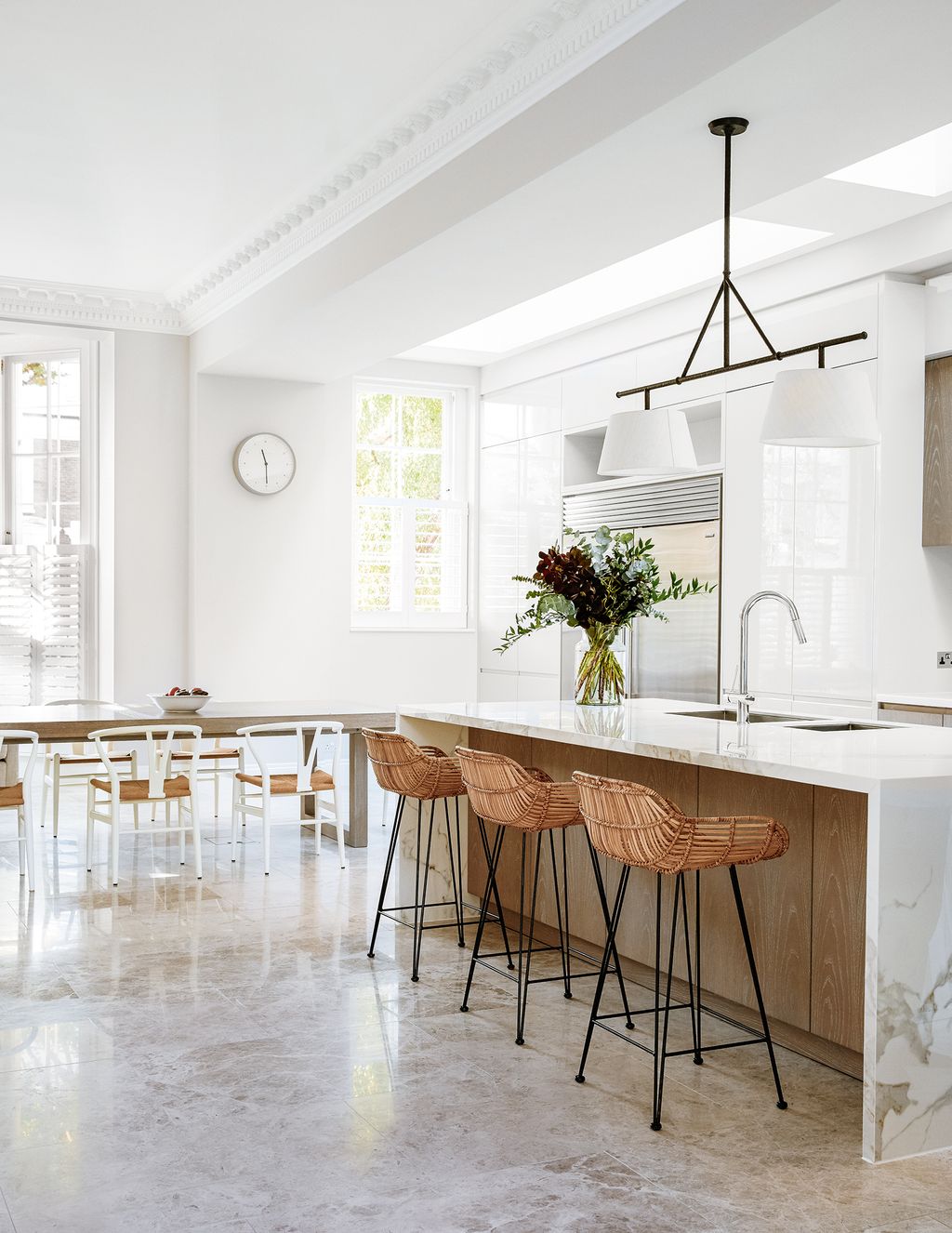 Kitchen Seating in a mix of styles including bar stools from Cox Cox creates a relaxed feel.