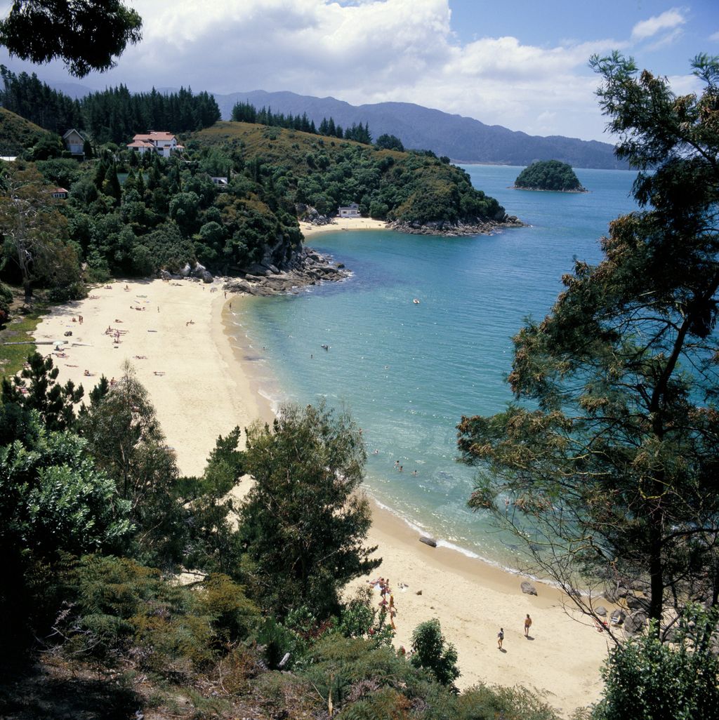 Image may contain Outdoors Nature Land Shoreline Water Ocean Sea Coast Promontory Tree Plant Human and Person