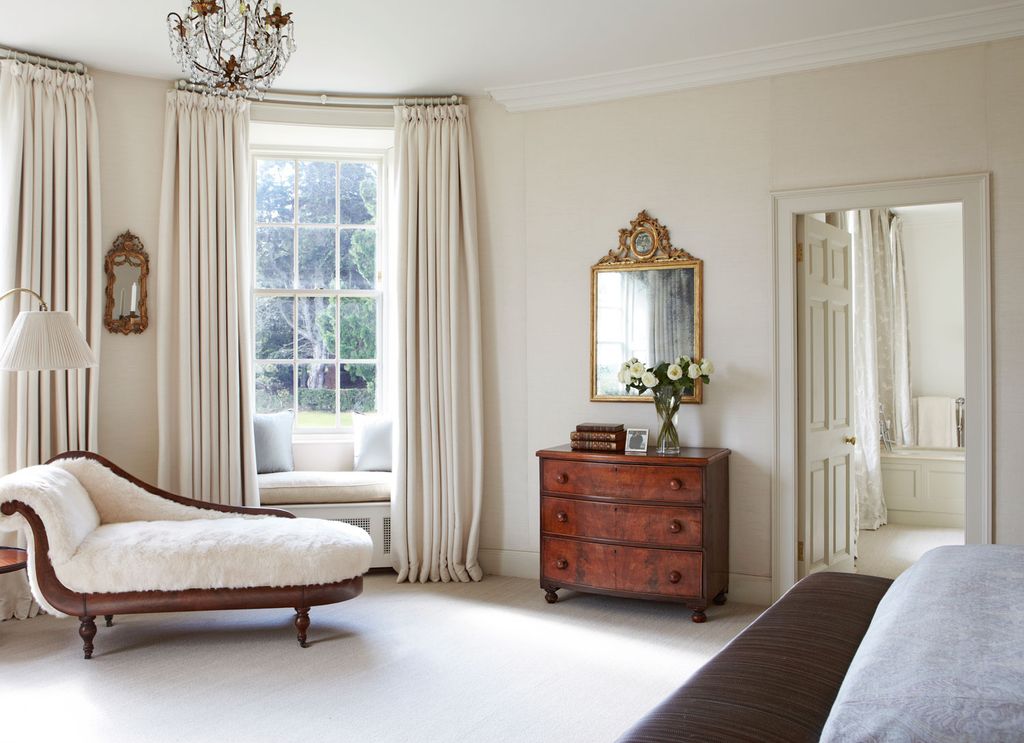 Image may contain Furniture Interior Design Indoors Room Bedroom Bed Living Room and Cabinet