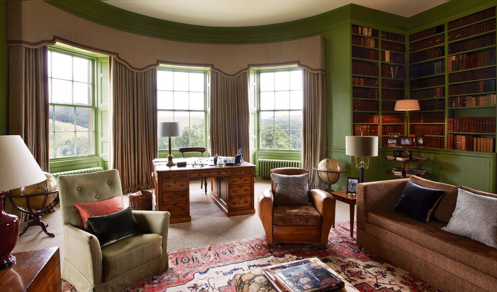 Image may contain Furniture Living Room Indoors Room Couch Chair and Rug