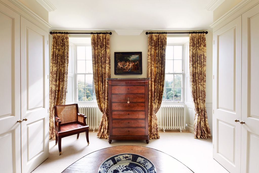 Image may contain Flooring Furniture Home Decor Floor Living Room Room Indoors Interior Design and Wood