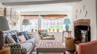 Image may contain Furniture Living Room Indoors Room Couch Cushion Interior Design Rug and Home Decor