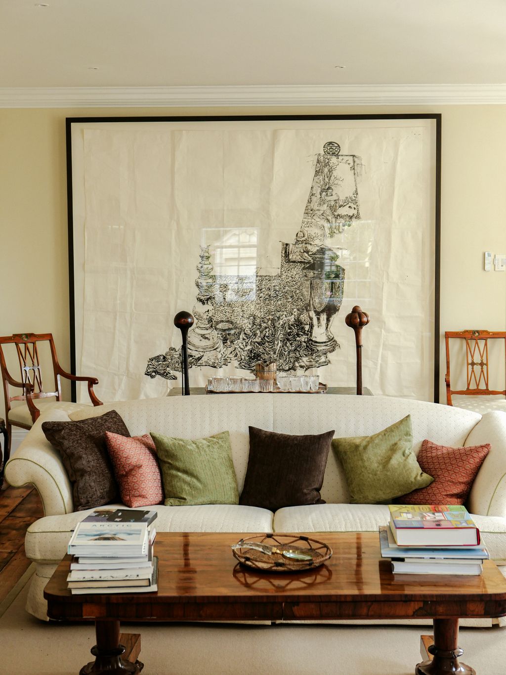 Image may contain Furniture Living Room Indoors Room Table Couch Coffee Table and Interior Design