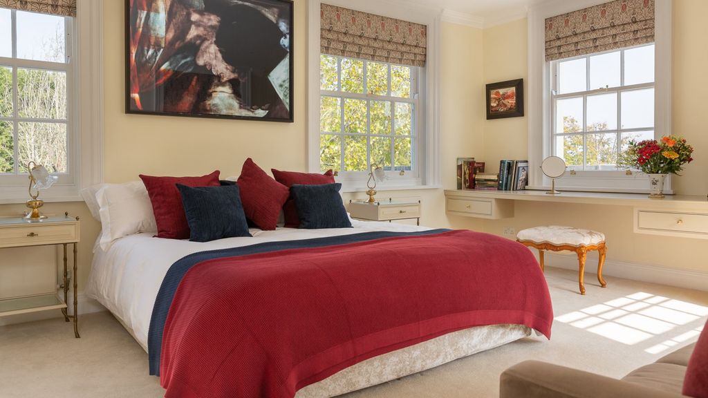 Image may contain Room Bedroom Indoors Furniture Cushion Rug Dorm Room and Living Room