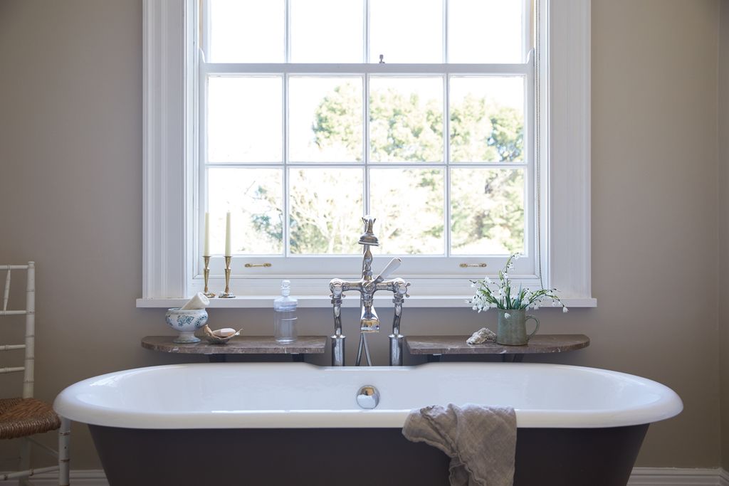 Image may contain Indoors Sink Sink Faucet Tub and Bathtub