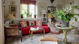 Image may contain Living Room Room Indoors Furniture Interior Design Couch Flooring Rug Table and Lobby