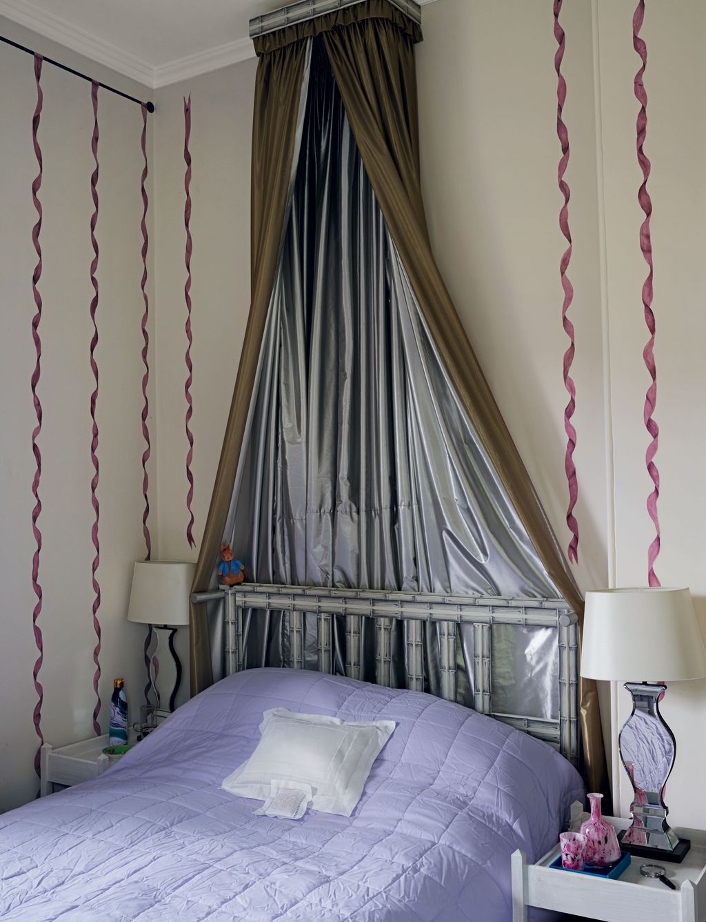 Nicky applied cutout bamboo papier peint wallpaper by Mauny to add decorative detail to the bed headboard. The bed...