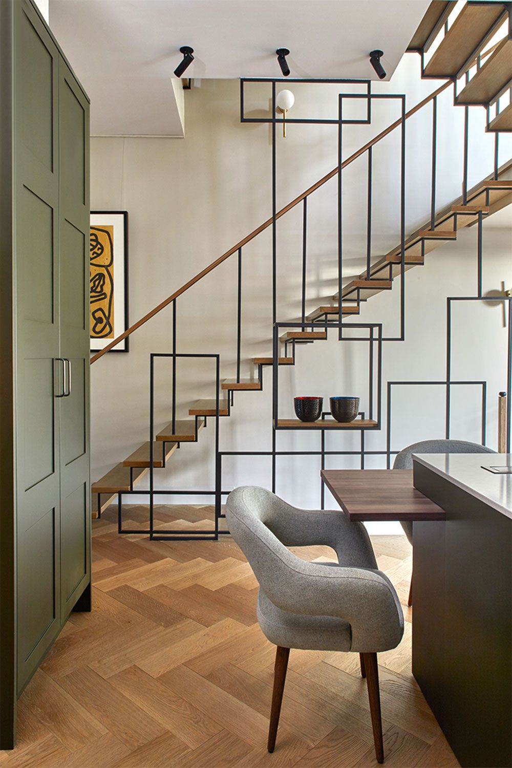Instead of closing up the staircase in this project Emmanulle Sivren decided to open it up to the kitchen making the...