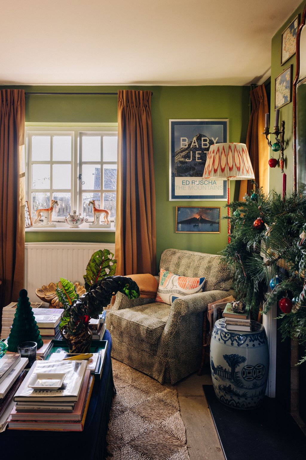 A vintage nbspColefax  Fowler chair sits in one corner covered in Colefax's leopard stripe fabric. The chard was picked...