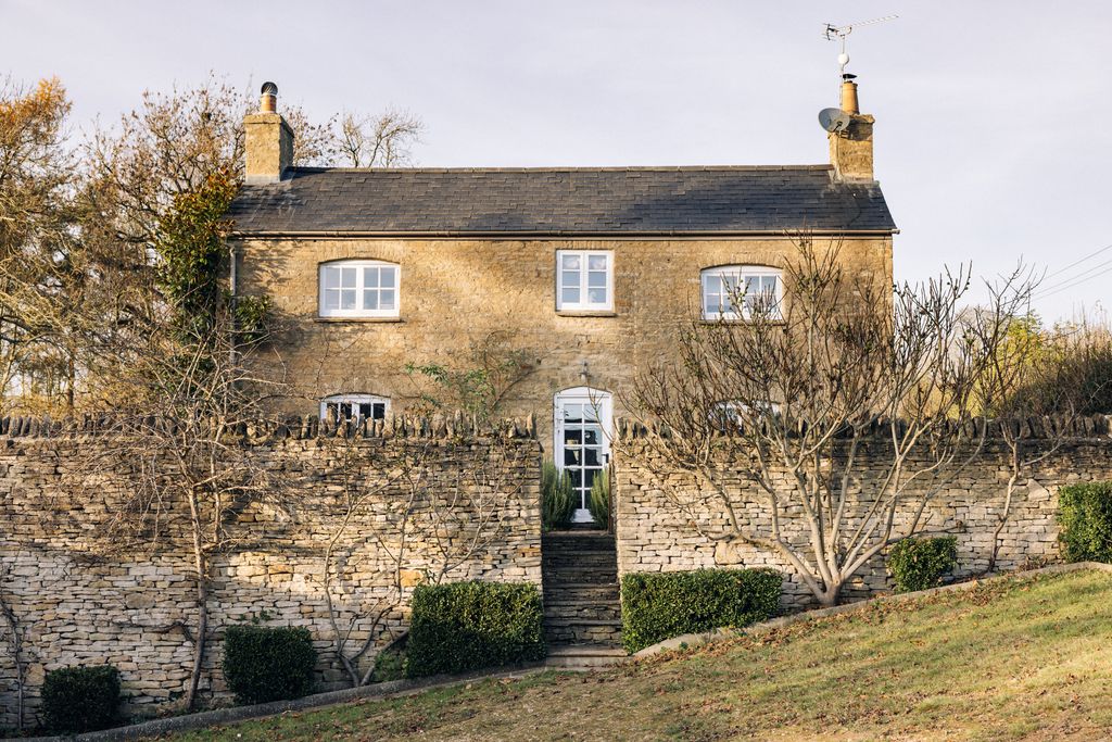 Image may contain Outdoors Nature Building Shelter Countryside Rural Wall Cottage Housing House Brick and Spire
