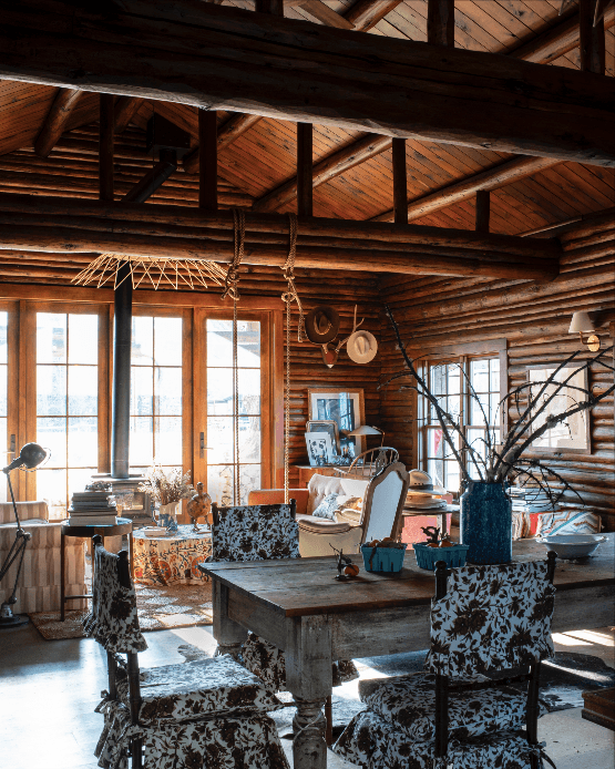 The interior walls of the 1950s cabin were removed to make a lighter more open space. The lamp on the left is a 1930s...