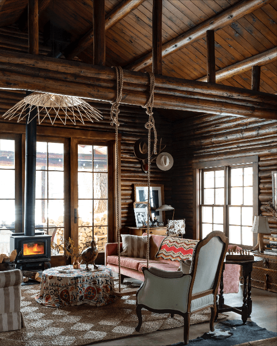 Image may contain Housing Building Furniture Chair Indoors Living Room Room Table and House