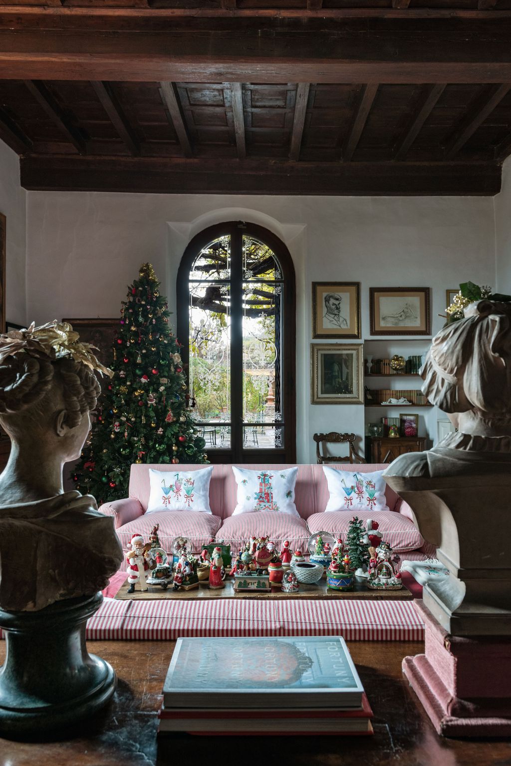 Image may contain Furniture Couch Living Room Room Indoors Plant and Tree