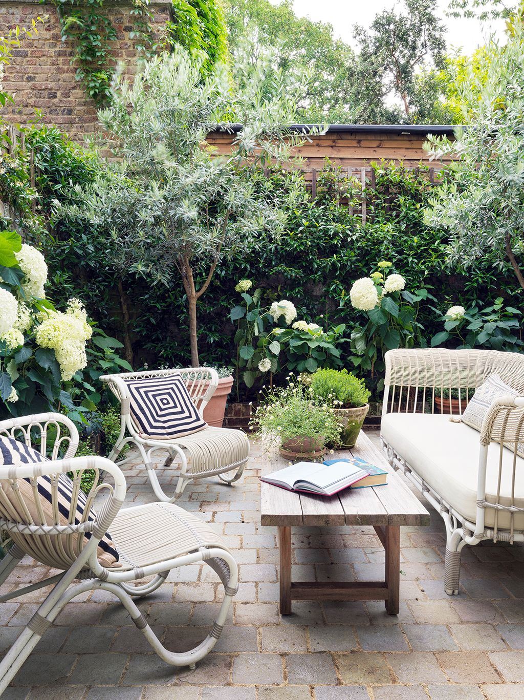 Image may contain Furniture Chair Couch Outdoors Table Patio Yard Nature Coffee Table Cushion and Pillow