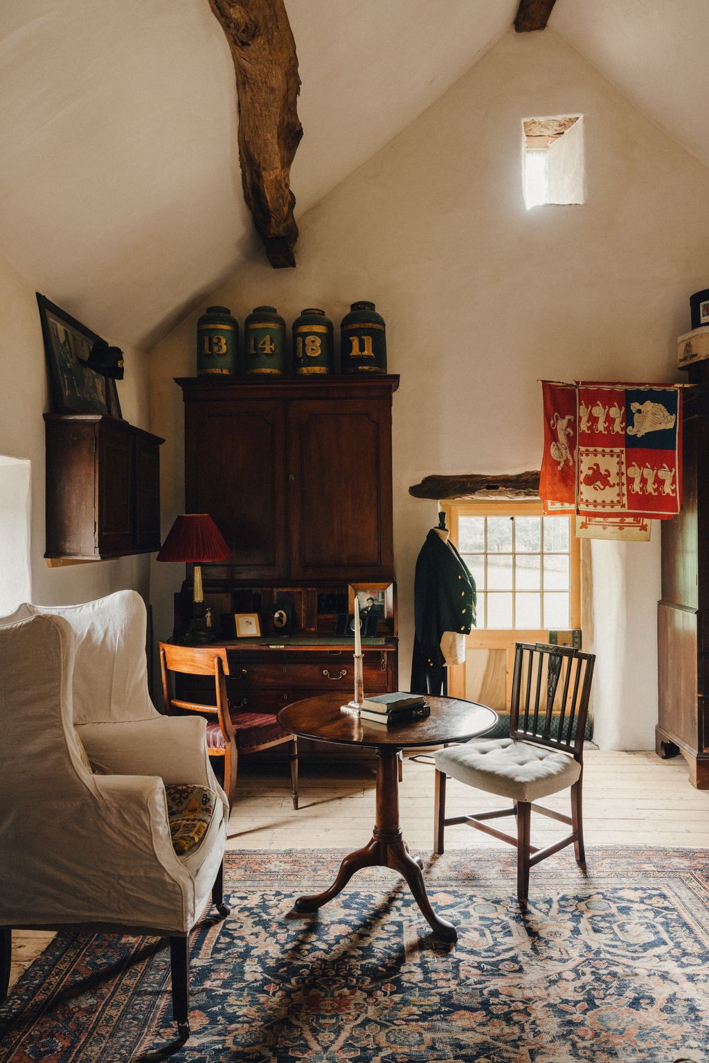 Image may contain Living Room Room Indoors Furniture Chair Wood Couch Hardwood Flooring Plywood and Rug