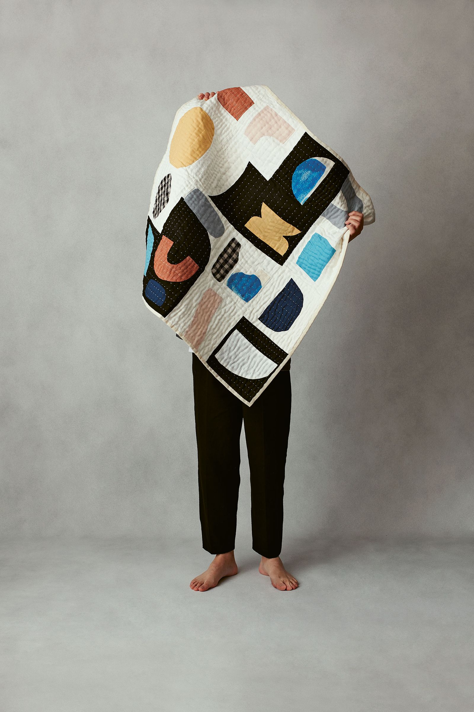 Image may contain Clothing Apparel Fashion Poncho Cloak Human and Person