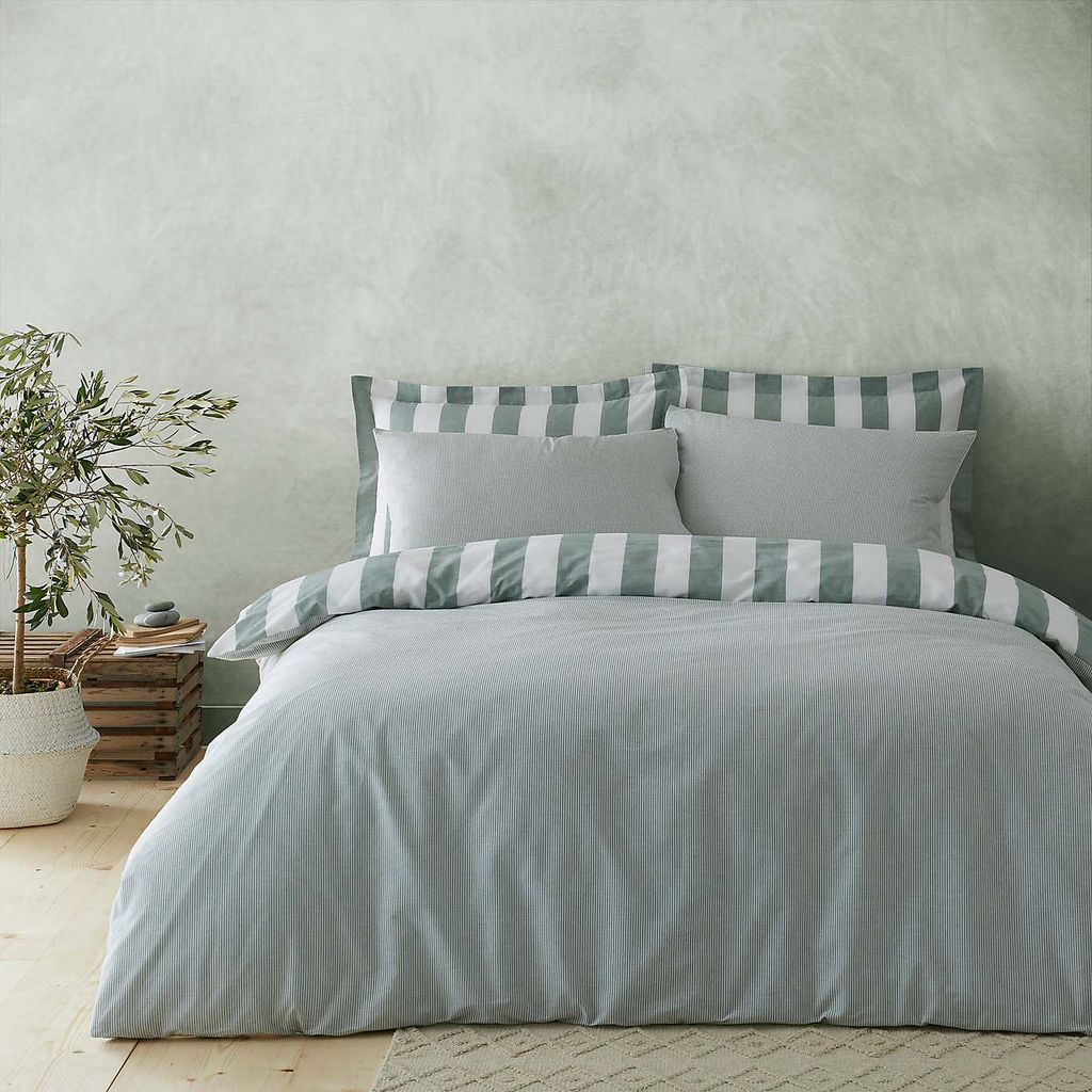 Image may contain Furniture Home Decor Cushion Room Bedroom Indoors Bed Linen and Pillow