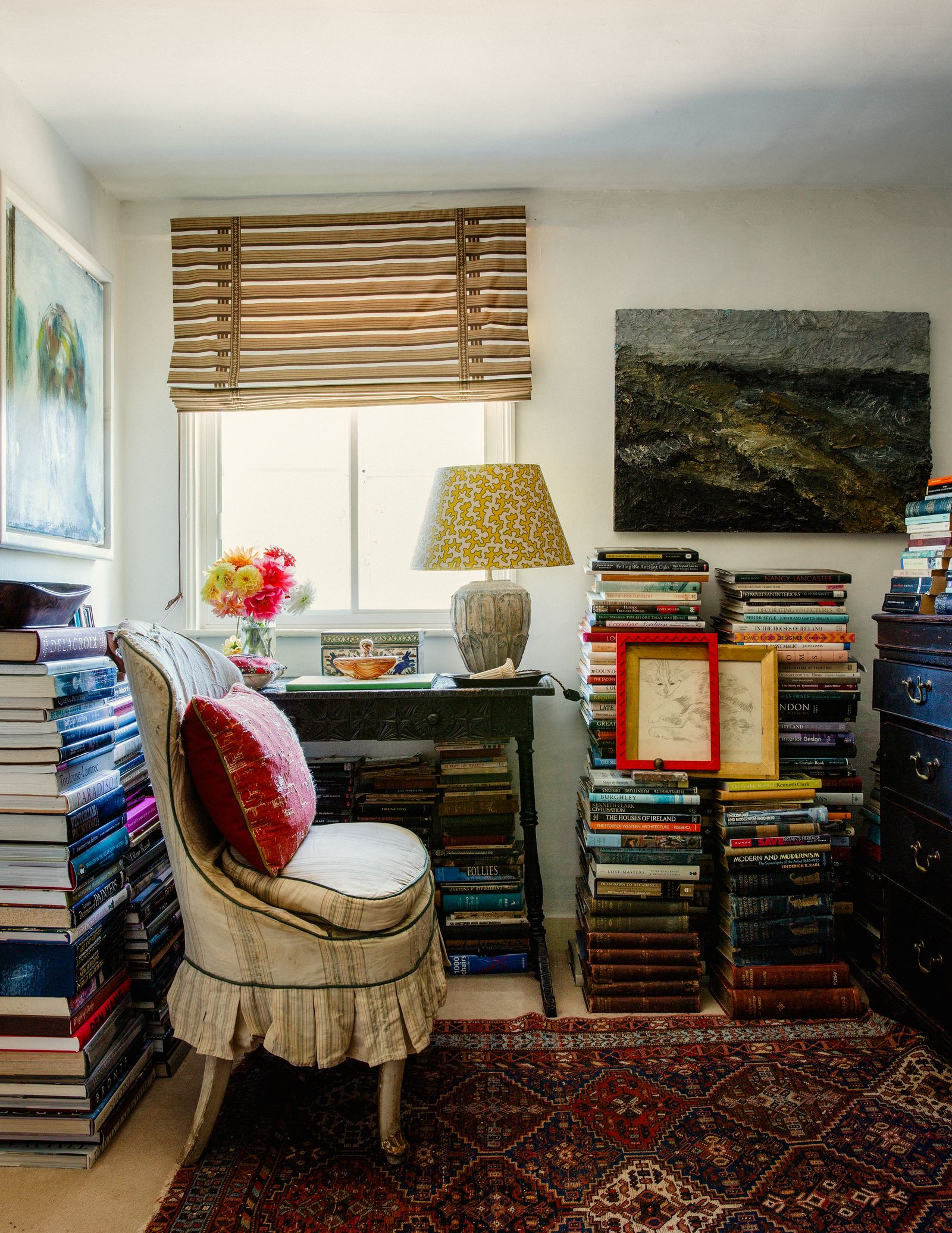 Image may contain Furniture Shelf Living Room Room Indoors Chair Bookcase Lamp Table Lamp and Interior Design