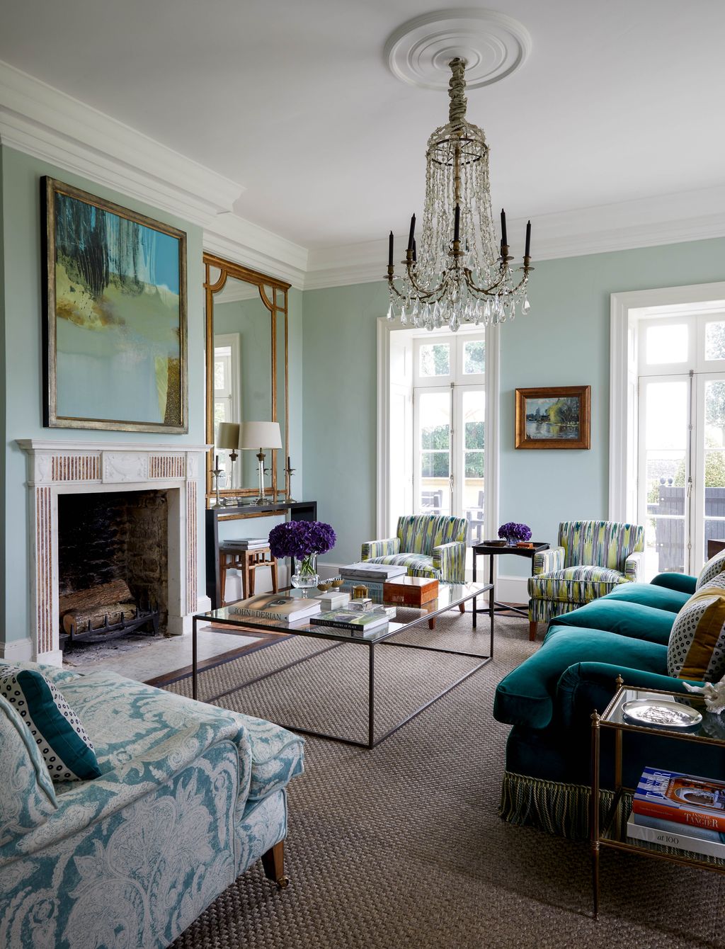 The glass chandelier in the drawing room is reclaimed from a town hall in Lyon in France it matches one in the dining...