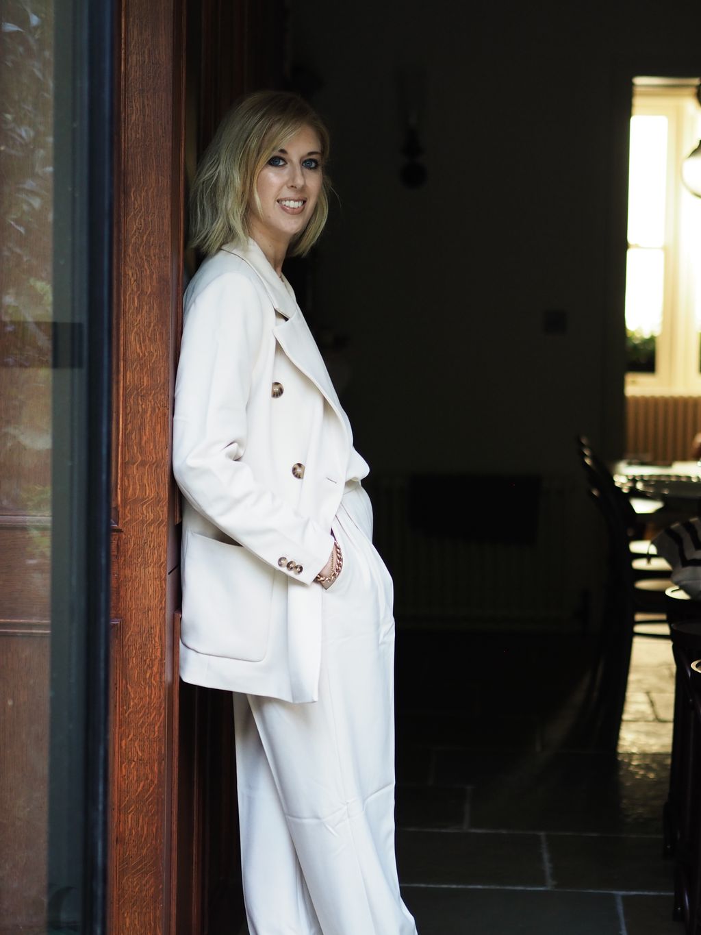 Image may contain Clothing Apparel Overcoat Coat Human Person Suit and Sleeve