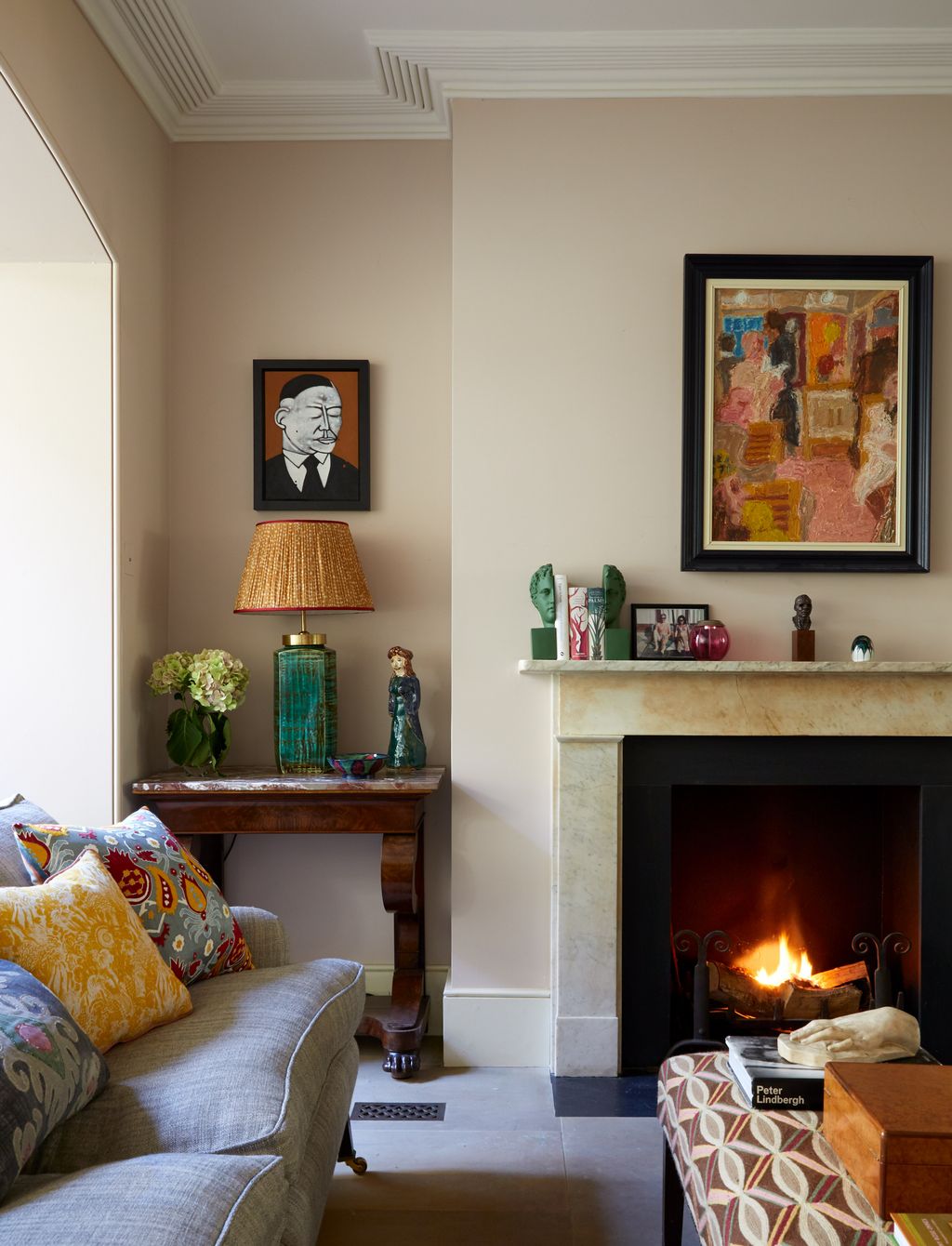 Image may contain Fireplace Indoors Living Room Room Hearth Cushion Sun Tzu Interior Design Furniture and Couch