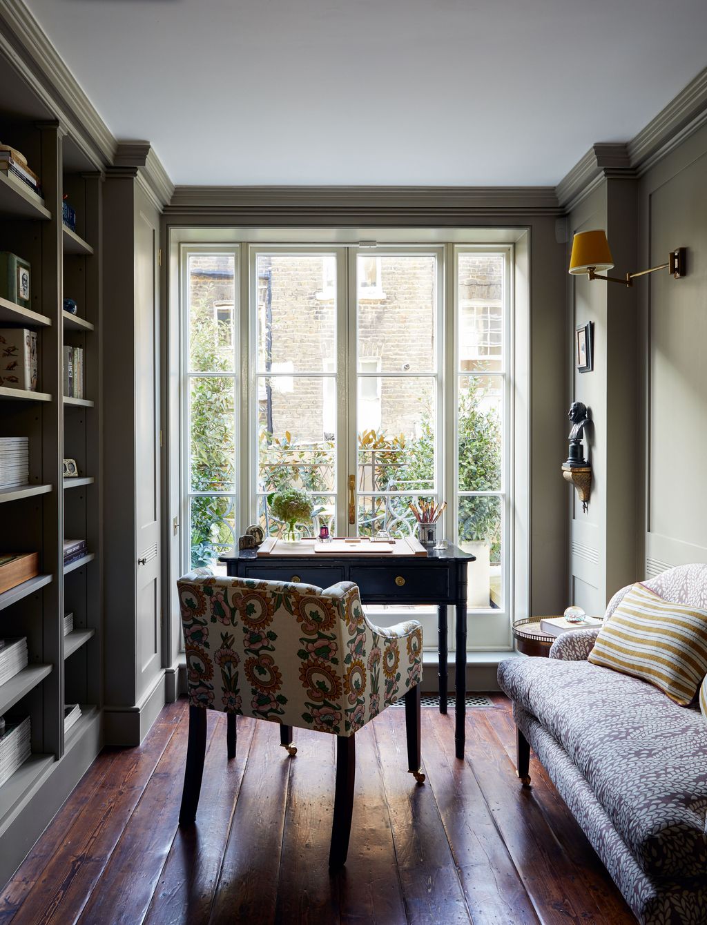 Image may contain Furniture Living Room Room Indoors Shelf Interior Design and Rug